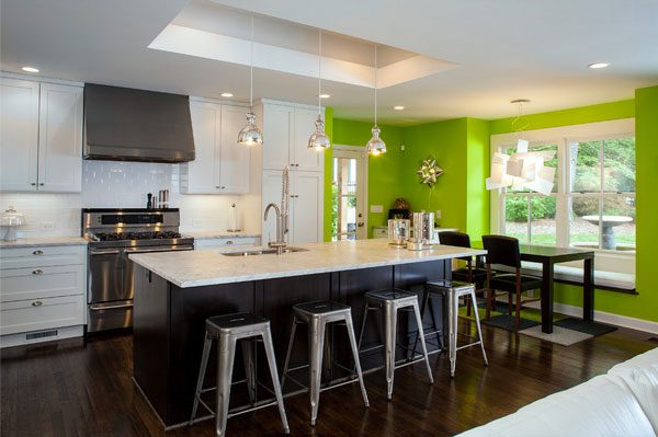 green accent wall kitchen black cabinet