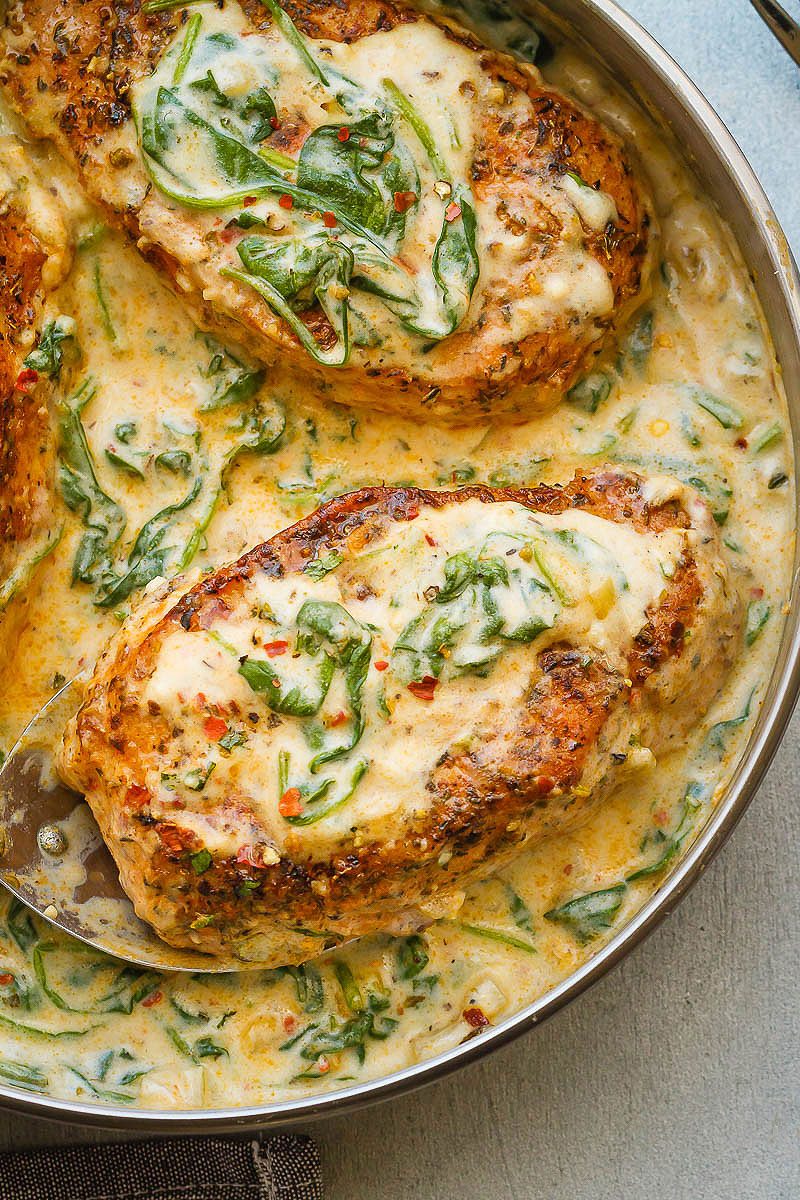 Boneless Pork Chops with Garlic Butter Spinach Sauce â€” Packed with flavor, a perfect meal for all of your family and friends to enjoy!