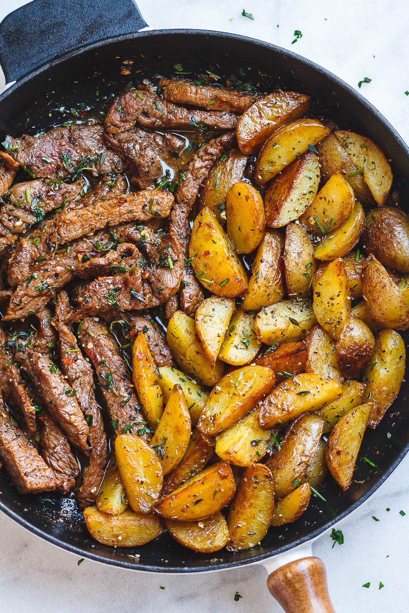 Garlic Butter Steak and Potatoes Skillet - This easy one-pan recipe is SO simple, and SO flavorful. The best steak and potatoes you'll ever have!